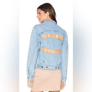 Understated Leather Go sit on a cactus Denim jacket